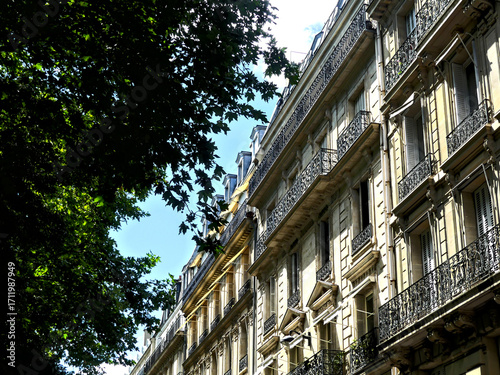 Paris, June 2025 : Visit of the magnificent city of Paris, Capital of France - View on different facades of buildings built by Baron Haussmann