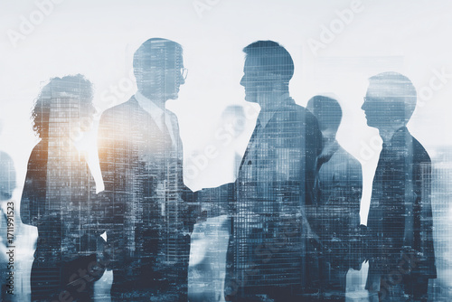 Business leaders engaging in strategic discussion, with city skyline overlay, symbolizing collaboration and innovation in corporate environment