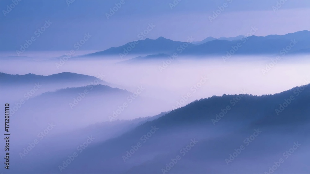 Fototapeta premium Misty Mountains with Layers of Hazy Blue Tones and Serene Scenery