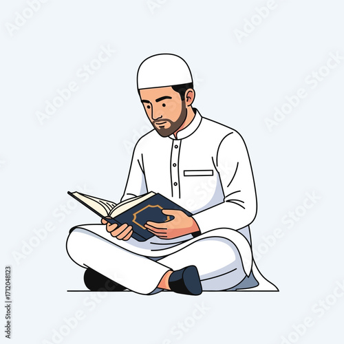 Man in white clothes reading a holy book.