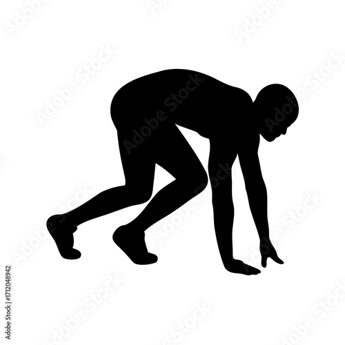 Silhouette of a runner in starting position ready to sprint or race