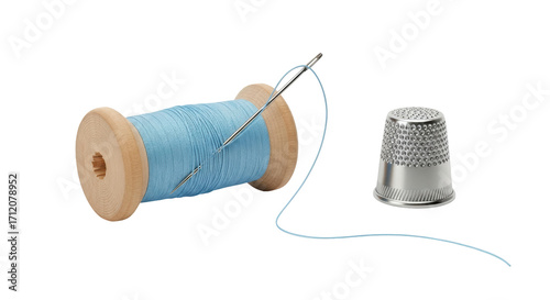 Isolated spool of blue thread with a needle and a thimble for sewing or embroidery