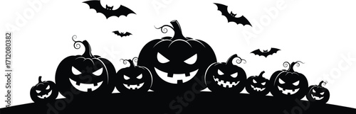 Spooky Halloween pumpkins with glowing eyes and flying bats create a festive and eerie scene.