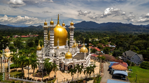 Aerial view of the golden dome of the Ubudiah Mosque at Kuala Kangsar, Perak, Malaysia