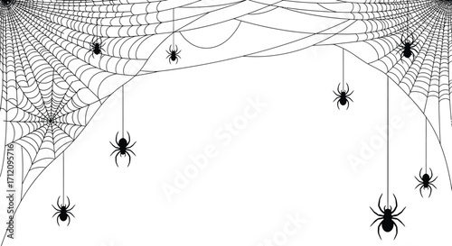 Spooky spiderwebs with hanging spiders create a creepy Halloween atmosphere