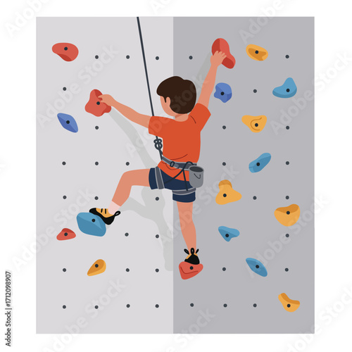 Young male athlete playing wearing a safety harness and climbing shoes,
