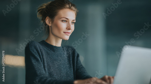 freelancer types intently on sleek laptop immersed in productive work session
