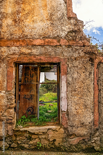 Rural architecture in Spain, abandoned and semi-ruined due to migration to cities, with daylight illumination.