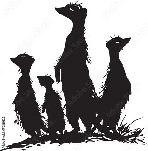 Alert meerkats stand guard in silhouette