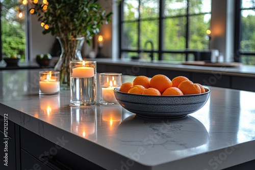 Bowl of oranges on counter.