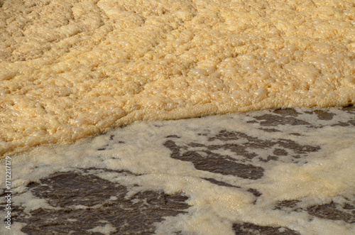 Quadro em tela A detailed and abstract view of foamy water in an aeration tank at a wastewater treatment plant