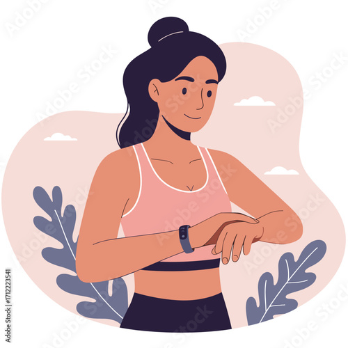 Young woman checking fitness tracker during outdoor workout session  