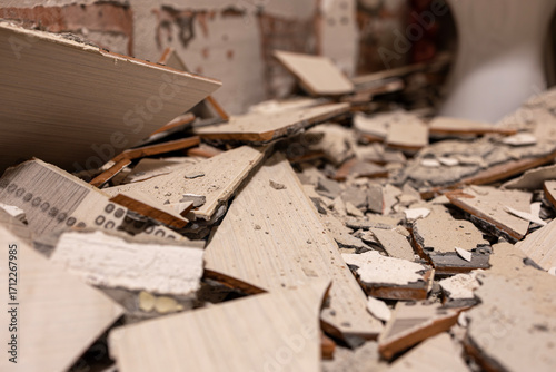 A close-up of a piece of dismantled ceramic tiles during renovations