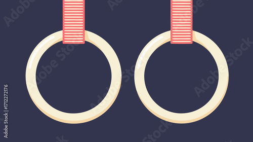Gymnastic rings hanging with red ribbons on dark background  