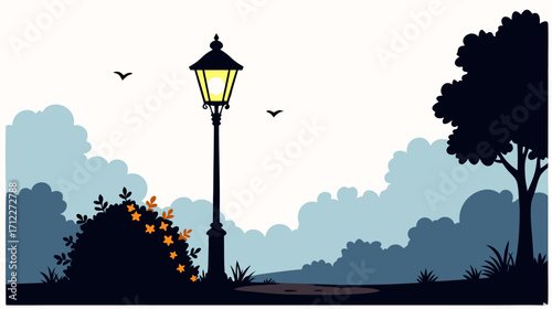 Silhouette of a street lamp beside a bush in a tranquil park  