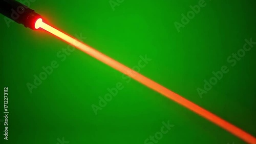 Vibrant red laser beam cutting through dark green space, an energetic dynamic motion graphics element perfect for tech visuals and futuristic effects
