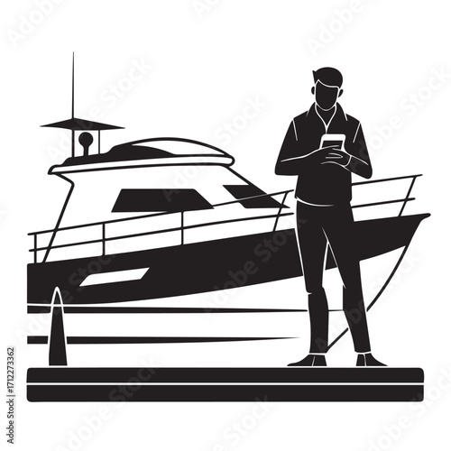 Silhouette of a man holding a phone standing on a dock next to a yacht