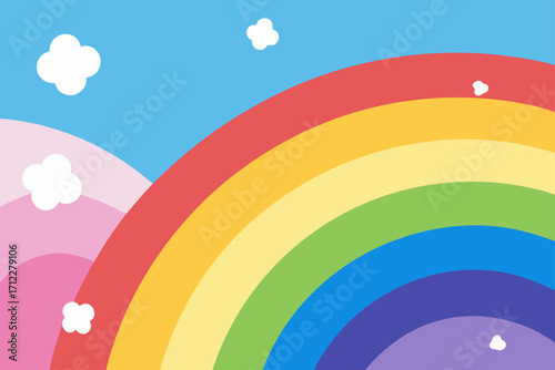 A vibrant, colorful rainbow arches across a bright blue sky, with fluffy clouds and a verdant landscape below