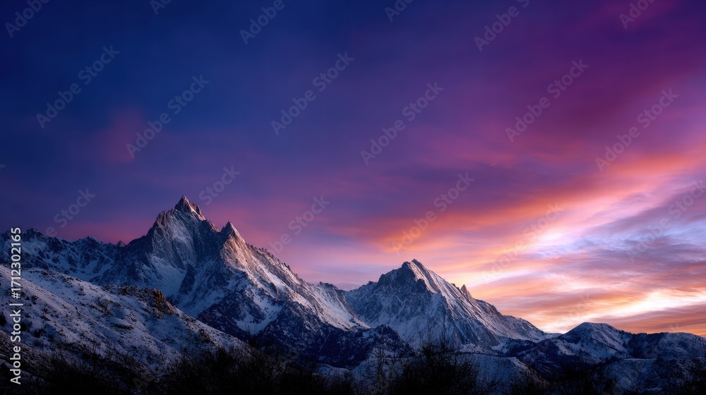 Fototapeta premium Majestic Snow-Capped Mountain Range at Sunset