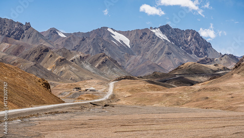 Scenic mountain landscape view of road to Ak Baital pass, highest point on Pamir Highway, Murghab, Gorno-Badakhshan, Tajikistan