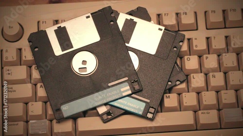Floppy disc FDD close up, Using diskette for old PC computer macro. Archive programme or Music recorder, playing retro computer games. Vintage device for office, obsolete technology. 