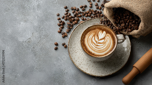 Freshly roasted aromatic coffee beans scattered on a modern surface in a warm, close-up view.