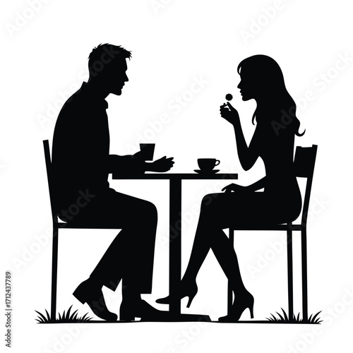 Couple silhouettes at cafe table with coffee cups and flower