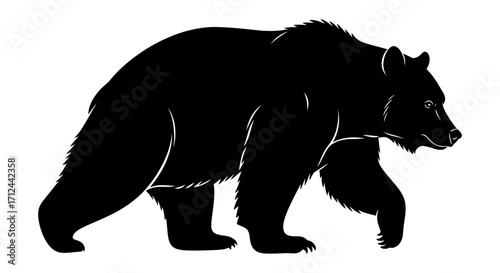 Silhouette of a large bear walking, profile view.