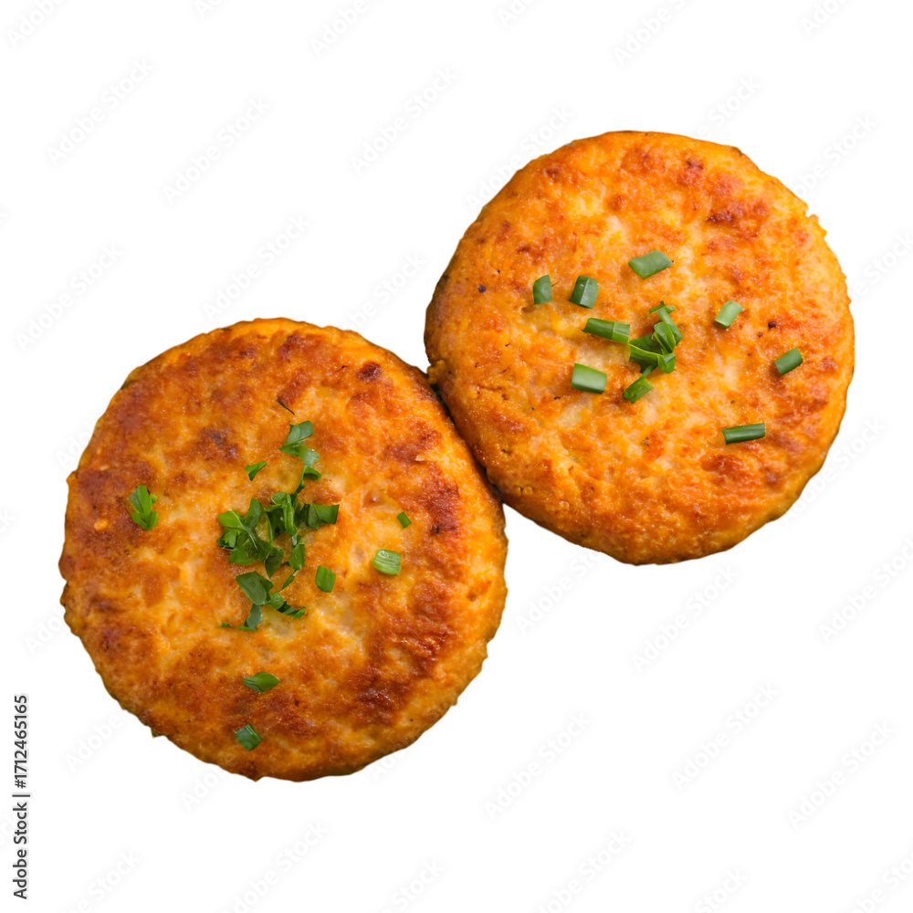 Fototapeta premium Two delicious, golden brown crispy fish cakes, garnished with fresh chives.