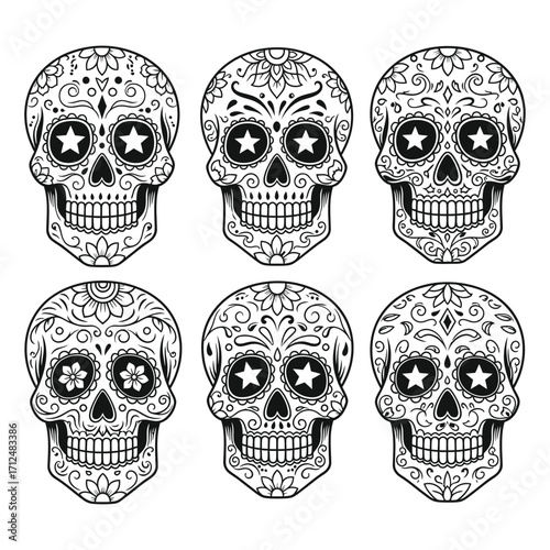 Set of six intricate black and white sugar skulls with floral and star decorations