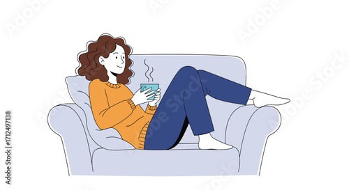 Relaxing woman enjoying a warm drink on a comfortable couch.