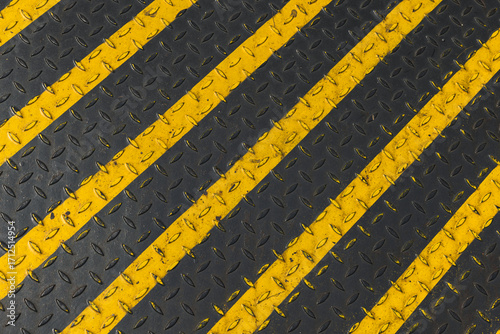 Wallpaper Mural Industrial black and yellow diagonal stripes painted on a metal surface Torontodigital.ca
