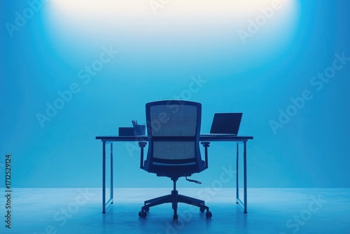 Minimalist workspace with an office chair, desk, laptop, and stationery, bathed in a cool, monochromatic blue light creates a peaceful ambiance.