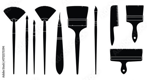 An assortment of painting tools and brushes in dark silhouette
