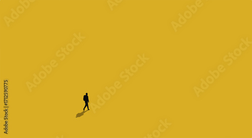 Lone figure in minimalist landscape features a person walking alone in bright yellow open space. Silhouette person walking alone in vast expanse evokes solitude, minimalism,