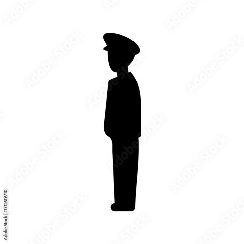 Silhouette of a uniformed person standing still, facing left side perspective