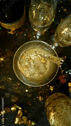 Freeze motion of pouring champagne into flute. Concept of celebration and suc...