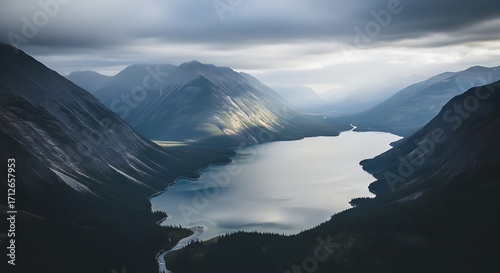 Serene Mountain Lake Landscape Under Cloudy Sky.