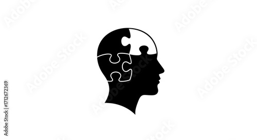 Human head silhouette with jigsaw puzzle pieces representing thought.