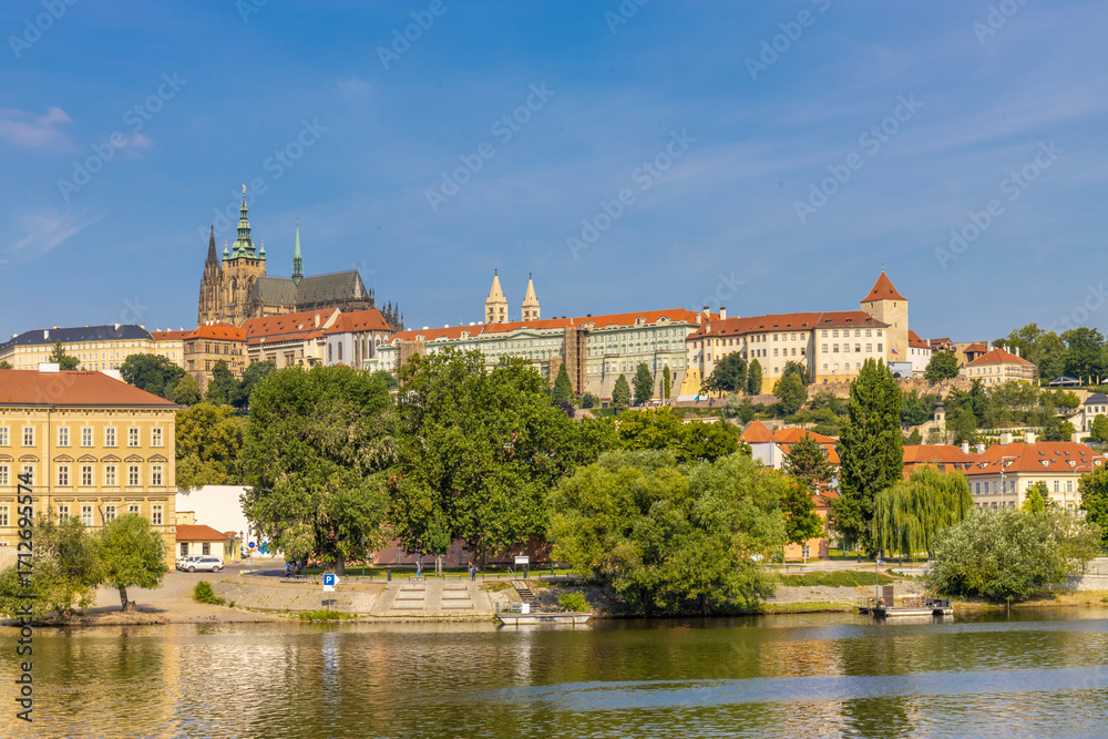 Fototapeta premium Prague cityscape, the capital of Czech Republic tourist sights. Prague historic center district at Charles bridge during the day. Busy tourist area city sights of Prague, capital of Czech