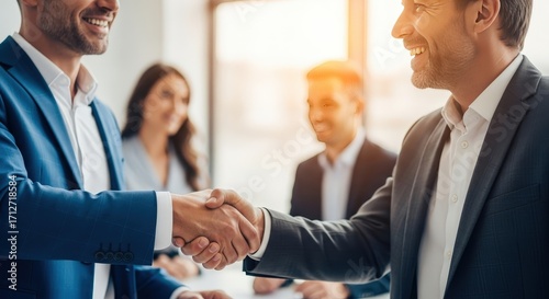 Businessmen shaking hands in professional office setting