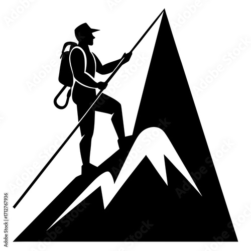 Climber on mountain peak with rope summit