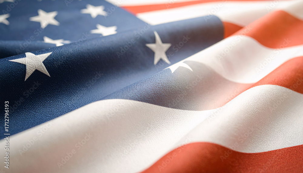 Fototapeta premium Close up of American flag fabric with stars and stripes detail