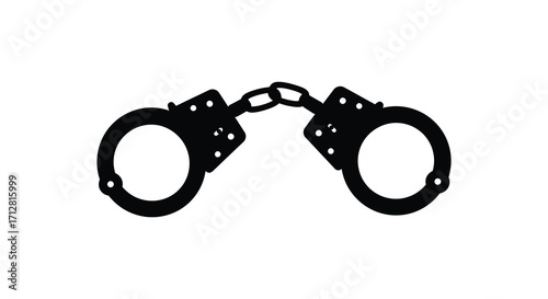 Black metal handcuffs shown in a stark isolated image silhouette