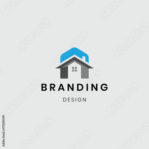 A logo showing a house with buildings, symbolizing real estate, construction, and property development. Suitable for architecture firms, real estate agencies, home builders, and construction businesse