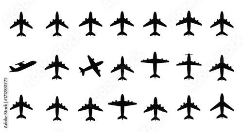 A collection of black silhouette airplanes and jets arranged on a white background