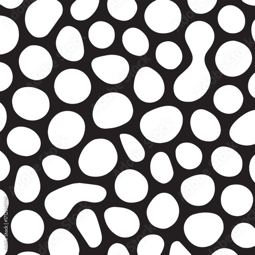Abstract organic pattern of white irregular shapes on a black background creating a textured cellular or bubbly visual effect