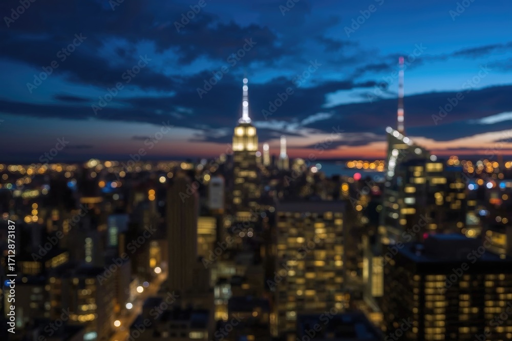 Obraz premium Nighttime blurred city skyline with bokeh effect captured at twilight using a wide-angle lens, focusing on the downtown area