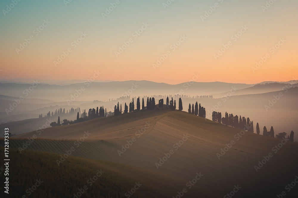 Naklejka premium Foggy sunrise over rural farmland at dawn