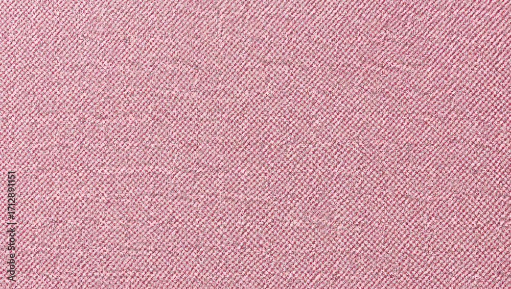 Fototapeta premium Jacquard textile in pink featuring a wide, relaxed diagonal weave with a rough texture, ideal for upholstery and fabric backgrounds. Close-up of fabric structure, wallpaper, and furniture material.